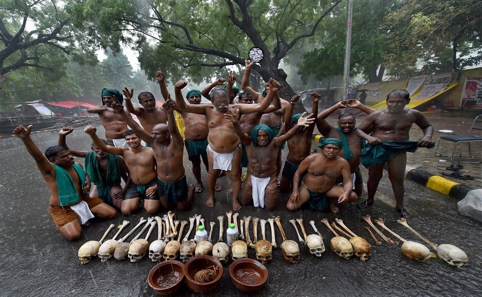 The farmers, clad in green loin cloth, demonstrated with the skulls of their peers and two bottles of poison. P Ayyakkannu, the leader of the group of farmers said that, “Rain or sun, our agitation will not stop,” PTI The farmers, clad in green loin cloth, demonstrated with the skulls of their peers and two bottles of poison. P Ayyakkannu, the leader of the group of farmers said that, “Rain or sun, our agitation will not stop,” PTI