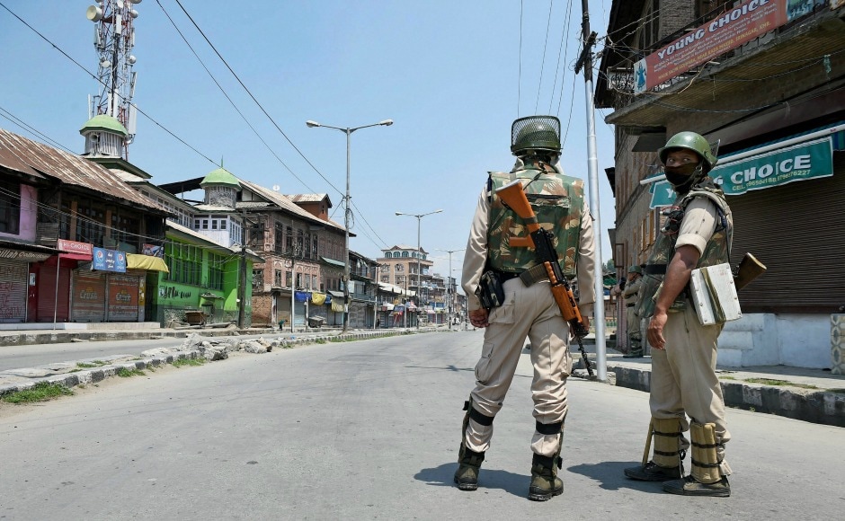 Two security personnel stand guard during a restriction in Anantnag. PTI Two security personnel stand guard during a restriction in Anantnag. PTI
