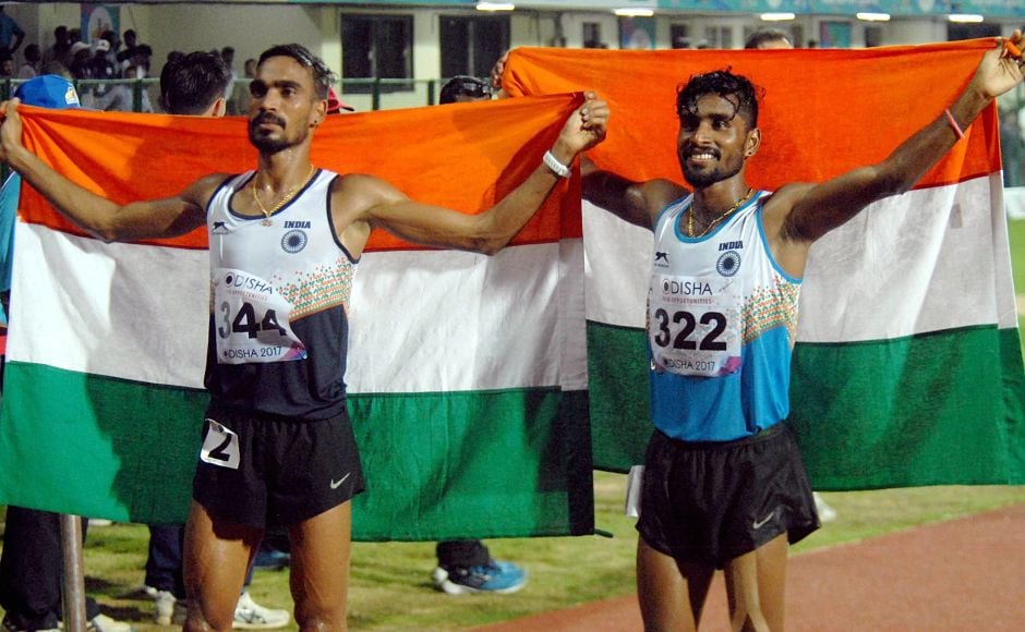 G Lakshmanan (R) and Gopi Thonakal after winning Gold and Silver respectively in Men's 10,000 mtr event. PTI G Lakshmanan (R) and Gopi Thonakal after winning Gold and Silver respectively in Men's 10,000 mtr event. PTI