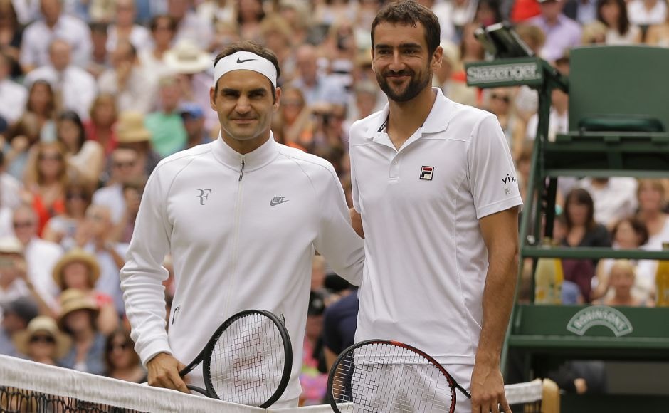 Roger Federer and Marin Cilic pose for a photo at the net before the Wimbledon final. Federer won the toss and elected to receive. AP Roger Federer and Marin Cilic pose for a photo at the net before the Wimbledon final. Federer won the toss and elected to receive. AP