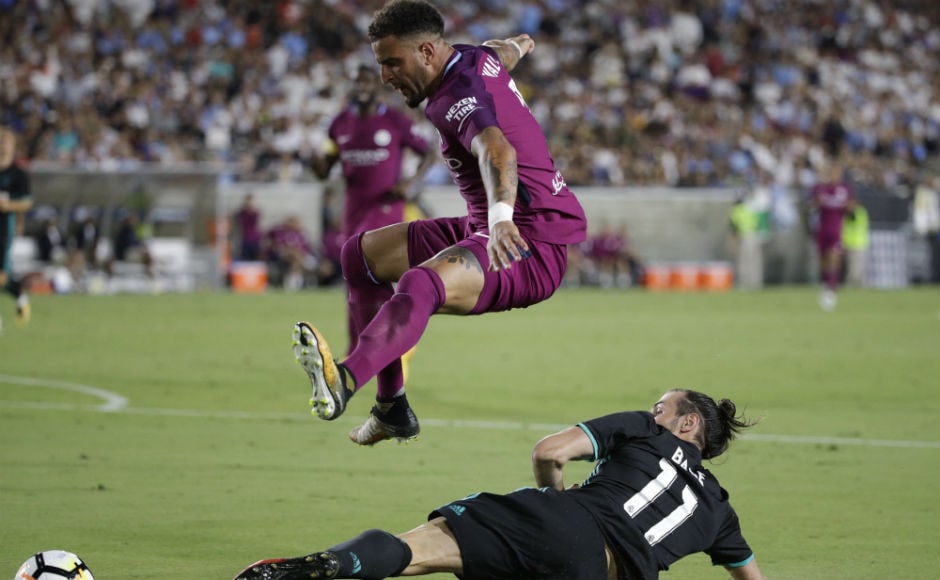 Manchester City's Kyle Walker, top, avoids a tackle from Real Madrid's Gareth Bale during the second half. AP Manchester City's Kyle Walker, top, avoids a tackle from Real Madrid's Gareth Bale during the second half. AP