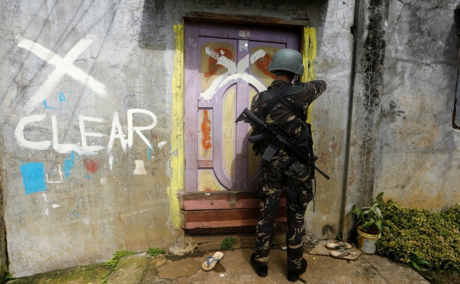 A member of the Philippine National Police closes a door after marking a house as clear while government troops continue their assault against insurgents from the Maute group in Marawi city. According to government sources some 1,500 homes still need to be cleared of explosives and soldiers are able to clear only 70 to 100 homes a day. Reuters A member of the Philippine National Police closes a door after marking a house as clear while government troops continue their assault against insurgents from the Maute group in Marawi city. According to government sources some 1,500 homes still need to be cleared of explosives and soldiers are able to clear only 70 to 100 homes a day. Reuters