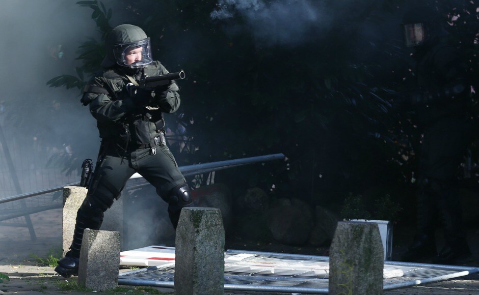 Around 12,000 protesters gathered in Hamburg started hurling bottles and stones to which German police responded with firing tear gas. Reuters Around 12,000 protesters gathered in Hamburg started hurling bottles and stones to which German police responded with firing tear gas. Reuters