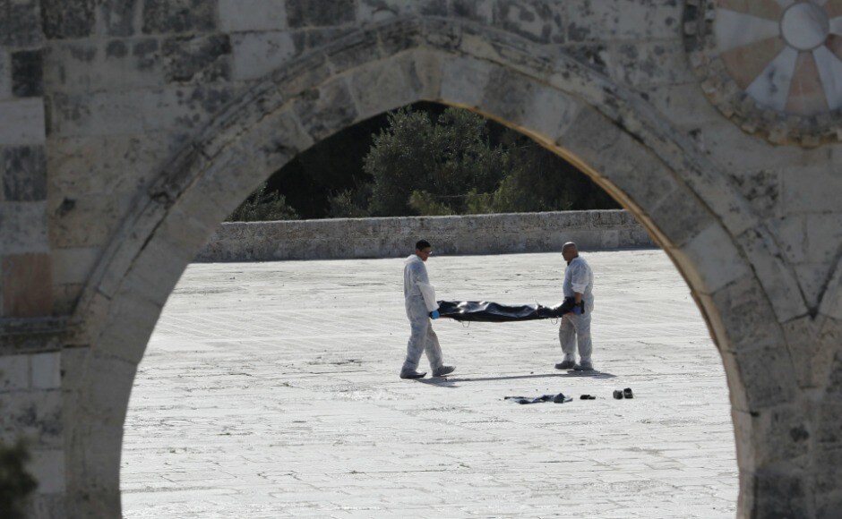Israeli policemen carry the body of an assailant after he was shot dead by Israeli police. Israeli authorities shut the area to Muslims who had gathered for Friday prayers, drawing a call for resistance from Palestinian religious leaders. Reuters Israeli policemen carry the body of an assailant after he was shot dead by Israeli police. Israeli authorities shut the area to Muslims who had gathered for Friday prayers, drawing a call for resistance from Palestinian religious leaders. Reuters