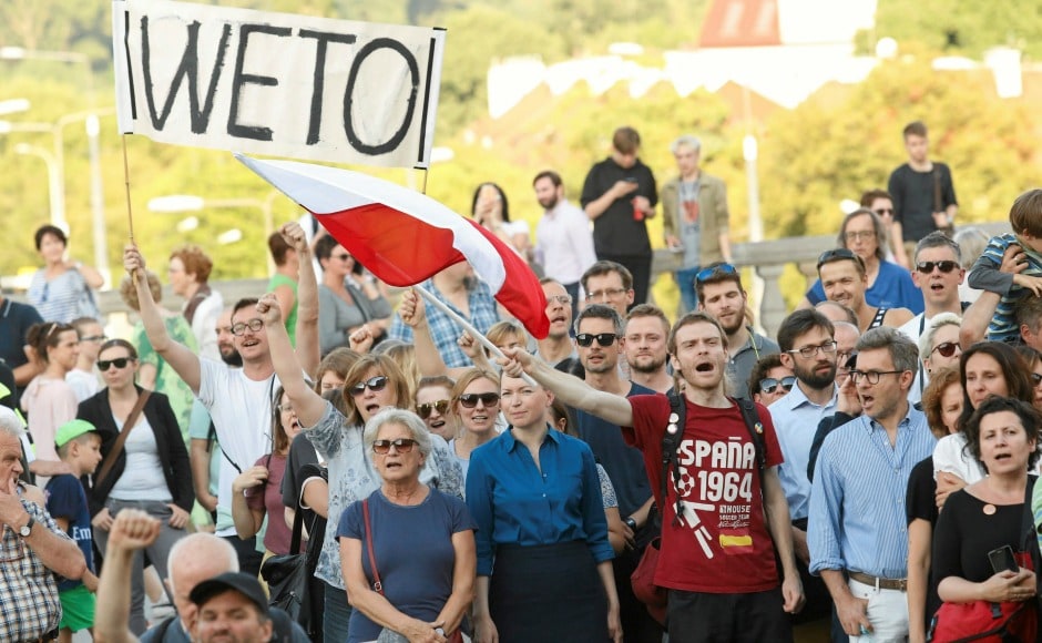 Thousands of protesters across the country took to the streets demanding President Andrzej Duda to veto the bills tabled in Parliament that would give him the power to influence the highest courts. AP Thousands of protesters across the country took to the streets demanding President Andrzej Duda to veto the bills tabled in Parliament that would give him the power to influence the highest courts. AP