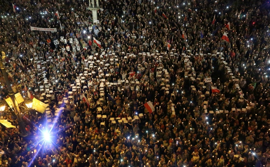 Crowds of thousands gathered in Warsaw, Krakow and other Polish cities chanted 'free courts' and waved placards protesting against the draft bill. AP Crowds of thousands gathered in Warsaw, Krakow and other Polish cities chanted 'free courts' and waved placards protesting against the draft bill. AP