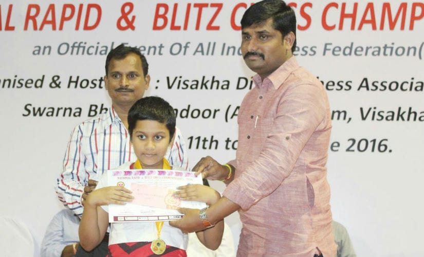 Sahithi Varshini with her gold medal in under-9 category in the National Rapid Championship.