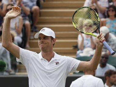 Sam Querrey of the United States celebrates after beating Jo—Wilfried Tsonga of France in the Men's Singles Match on day six at the Wimbledon Tennis Championships in London Saturday, July 8, 2017. (AP Photo/Kirsty Wigglesworth)