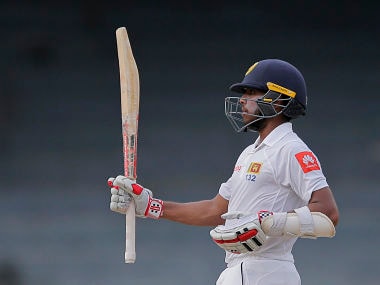 Sri Lanka's Kusal Mendis raises his bat after scoring fifty runs during the fourth day of the only Test match against Zimbabwe. AP