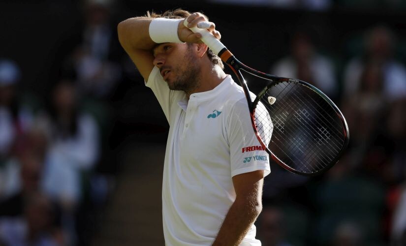 Switzerland's Stan Wawrinka reacts during his Men's Singles Match against Russia's Daniil Medvedev on the opening day at the Wimbledon Tennis Championships in London Monday, July 3, 2017. (AP Photo/Kirsty Wigglesworth)