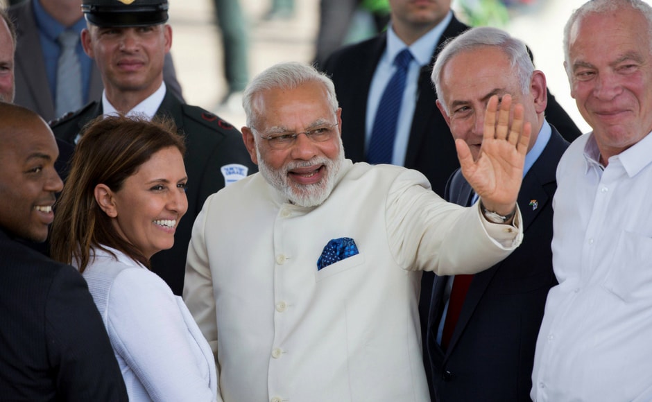 Prime Minister Narendra Modi (centre) accompanied by Israeli prime minister Benjamin Netanyahu (R) waves during the welcome ceremony. AP Prime Minister Narendra Modi (centre) accompanied by Israeli prime minister Benjamin Netanyahu (R) waves during the welcome ceremony. AP