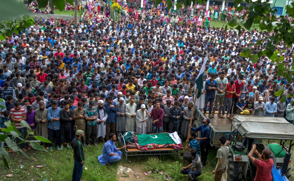 Kashmiri villagers offer prayers by the body of Showkat Lohar, a local militant, during his funeral in Arwani, about 55 kilometers south of Srinagar on Tuesday. AP Kashmiri villagers offer prayers by the body of Showkat Lohar, a local militant, during his funeral in Arwani, about 55 kilometers south of Srinagar on Tuesday. AP