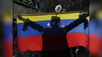 Opposition, government vie for votes as polarised Venezuela goes to polls today