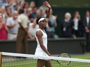 Venus Williams waves as she celebrates winning her match against Jelena Ostapenko. Reuters