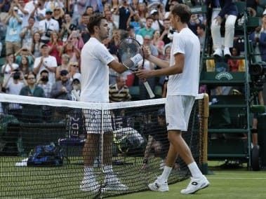 Daniil Medvedev (R) shakes hands with Stan Wawrinka after winning their first round. AFP 