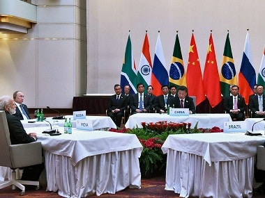 Xi Jinping and Narendra Modi durig the BRICS informal meeting. PTI