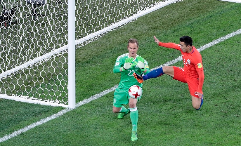 Chile’s Edson Raul Puch Cortez and Marc-Andre Ter Stegen challenge for the ball during the Confederations Cup final. AP