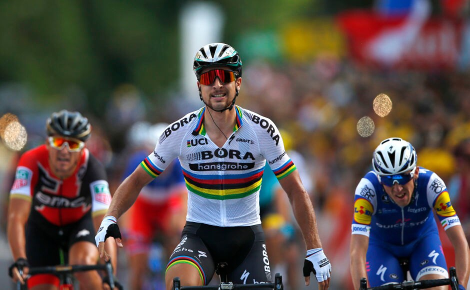 Peter Sagan of Slovakia, center, crosses the finish line ahead of Ireland's Daniel Martin, right, and Belgium's Greg van Avermaet, left, to win the third stage of the Tour de France cycling race. AP Peter Sagan of Slovakia, center, crosses the finish line ahead of Ireland's Daniel Martin, right, and Belgium's Greg van Avermaet, left, to win the third stage of the Tour de France cycling race. AP