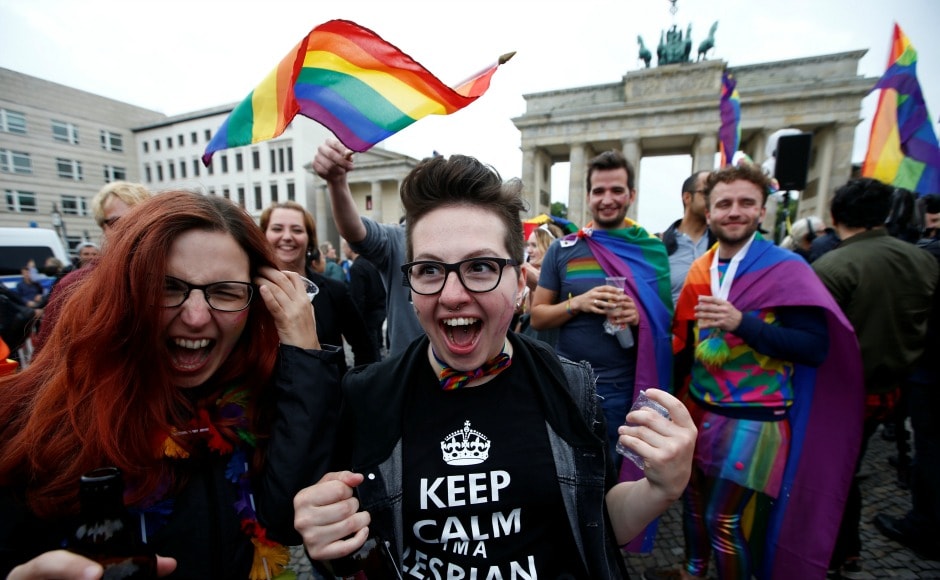After the decision was passed, hundreds of LGBT rights activists celebrated outside the Bundestag after the vote. The activists are seen waving rainbow flags and placards that read After the decision was passed, hundreds of LGBT rights activists celebrated outside the Bundestag after the vote. The activists are seen waving rainbow flags and placards that read
