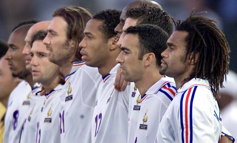 French national soccer team members listen to their national anthem before facing Morocco in the King Hassan II tournament in Casablanca June 6. The World champion squad arrived today in Belgium to prepare the upcoming Euro 2000 championship. France’s opening match in the Euro 2000 is against Denmark next Sunday in Bruges. L to R:Nicolas Anelka, Franck Leboeuf, Vincent Candela, Christophe Dugarry, Thierry Henry, Youri Djorkaeff and Christian Karembeu. CP//ME - RTRV5Z4