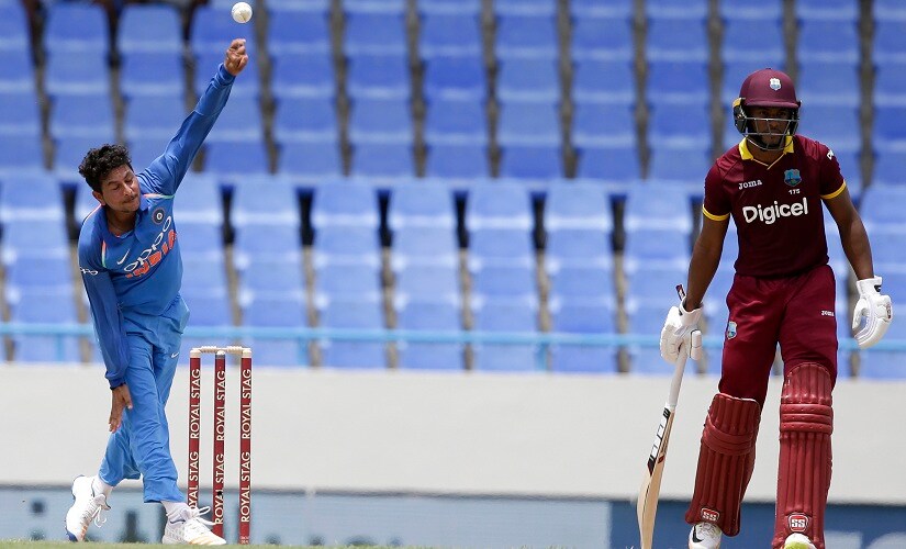 Kuldeep Yadav bowls against West Indies during the fourth ODI. AP
