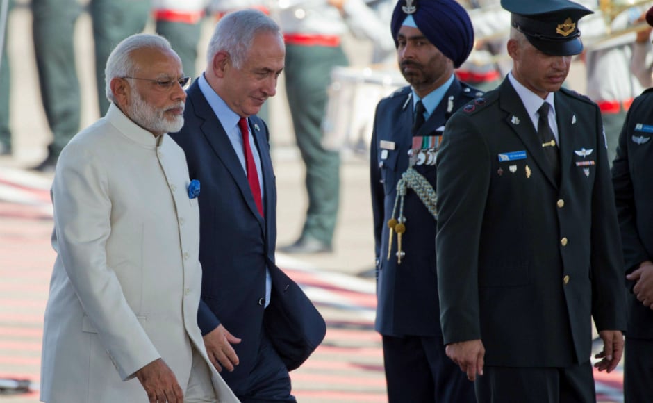 Narendra Modi (L) and Israeli prime minister Benjamin Netanyahu being escorted by Israeli officials to the stage during the welcome ceremony. AP Narendra Modi (L) and Israeli prime minister Benjamin Netanyahu being escorted by Israeli officials to the stage during the welcome ceremony. AP