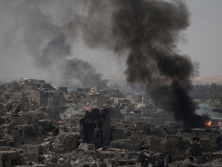 Sporadic clashes continue in Mosul after Haider al-Abadi declares victory over Islamic State