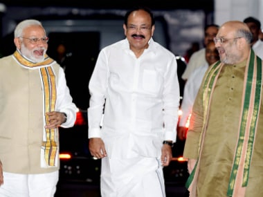 Venkaiah Naidu with Narendra Modi and Amit Shah on Monday. PTI