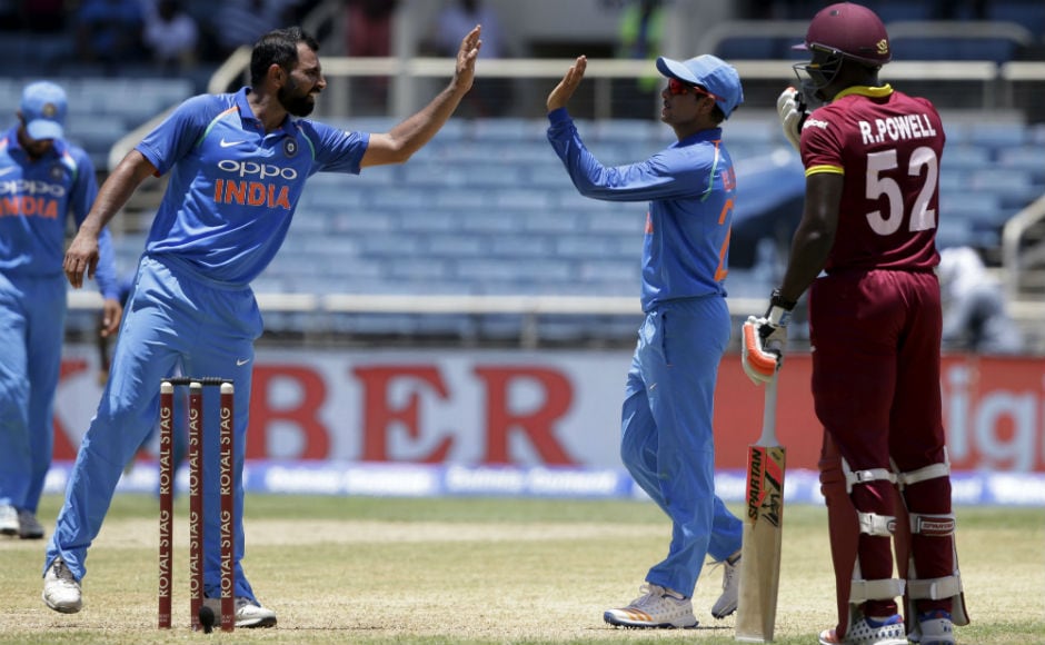 India's Mohammed Shami congratulates teammate Kuldeep Yadav for taking the catch to dismiss Windies' Ashley Nurse during the 5th ODI of the series at Sabina Park in Kingston, Jamaica. AP India's Mohammed Shami congratulates teammate Kuldeep Yadav for taking the catch to dismiss Windies' Ashley Nurse during the 5th ODI of the series at Sabina Park in Kingston, Jamaica. AP