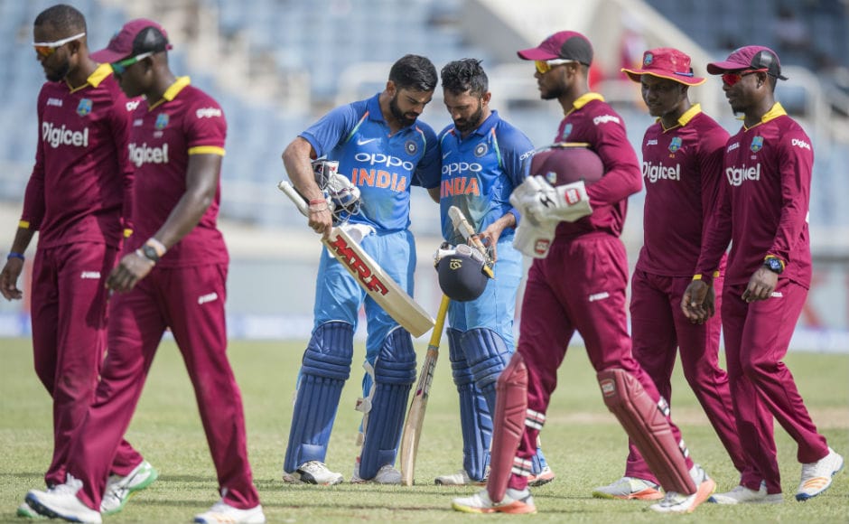 India beat the Windies by 8 wickets to win the 5th and last ODI of the series at Sabina Park in Kingston, Jamaica and took the series 3-1. Here, Virat Kohli (C) celebrates the victory with teammate Dinesh Karthik (R). AFP India beat the Windies by 8 wickets to win the 5th and last ODI of the series at Sabina Park in Kingston, Jamaica and took the series 3-1. Here, Virat Kohli (C) celebrates the victory with teammate Dinesh Karthik (R). AFP