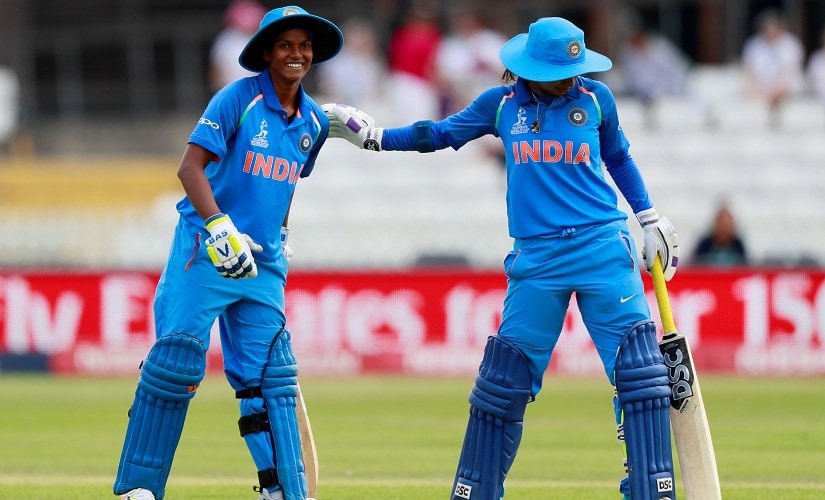 Deepti Sharma celebrates her 50 with Mithali Raj. Reuters