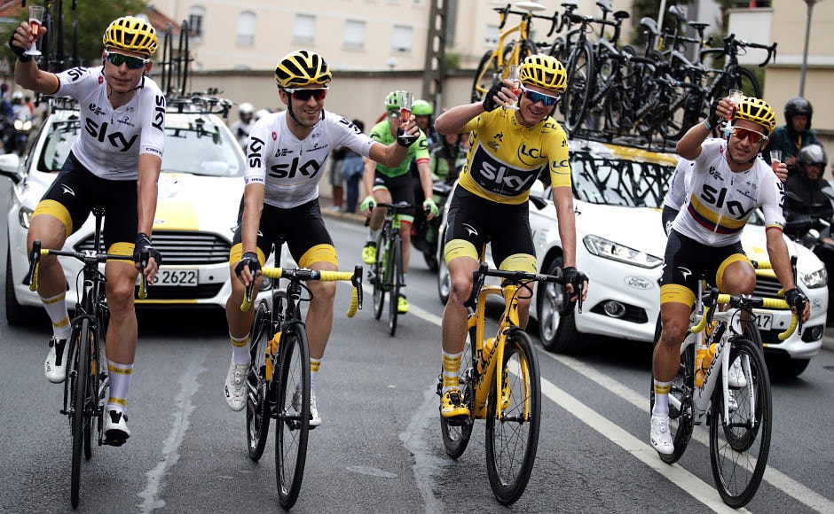 Chris Froome(yellow jersey), holds a toast with teammates Germany's Christian Knees(L), Spain's Mikel Nieve, (2nd from left), and Colombia's Sergio Henao Montoya. AP Chris Froome(yellow jersey), holds a toast with teammates Germany's Christian Knees(L), Spain's Mikel Nieve, (2nd from left), and Colombia's Sergio Henao Montoya. AP
