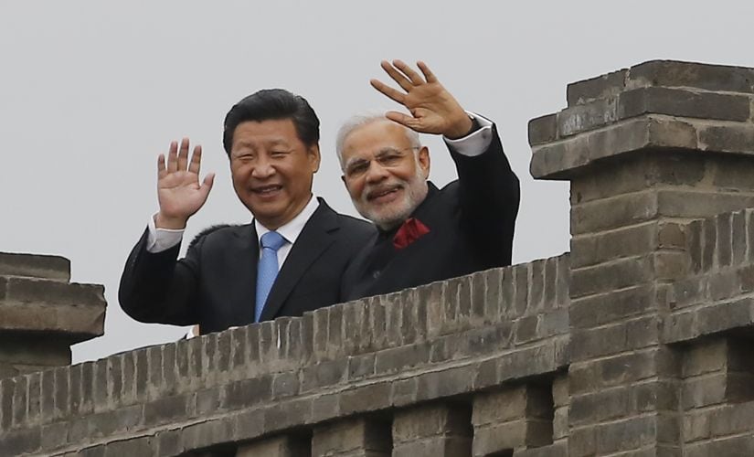 Reporters pored over the photo to ferret out the "more than thousand" words that supposedly lurked behind the smiles of Modi and Xi, but they found none. Getty Images