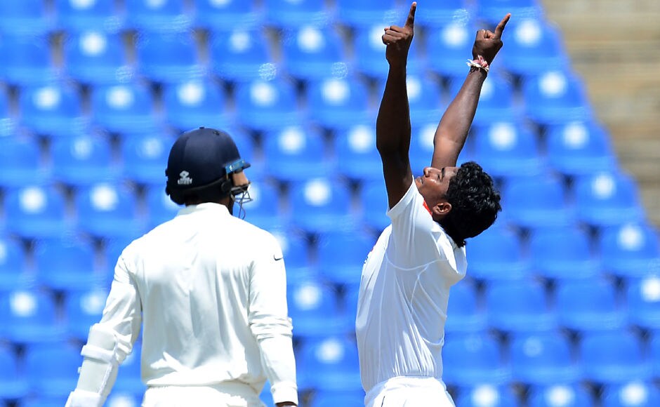 Lakshan Sandakan celebrates after bagging the final wicket of Hardik Pandya to complete career best figures of 5/132. AFP Lakshan Sandakan celebrates after bagging the final wicket of Hardik Pandya to complete career best figures of 5/132. AFP