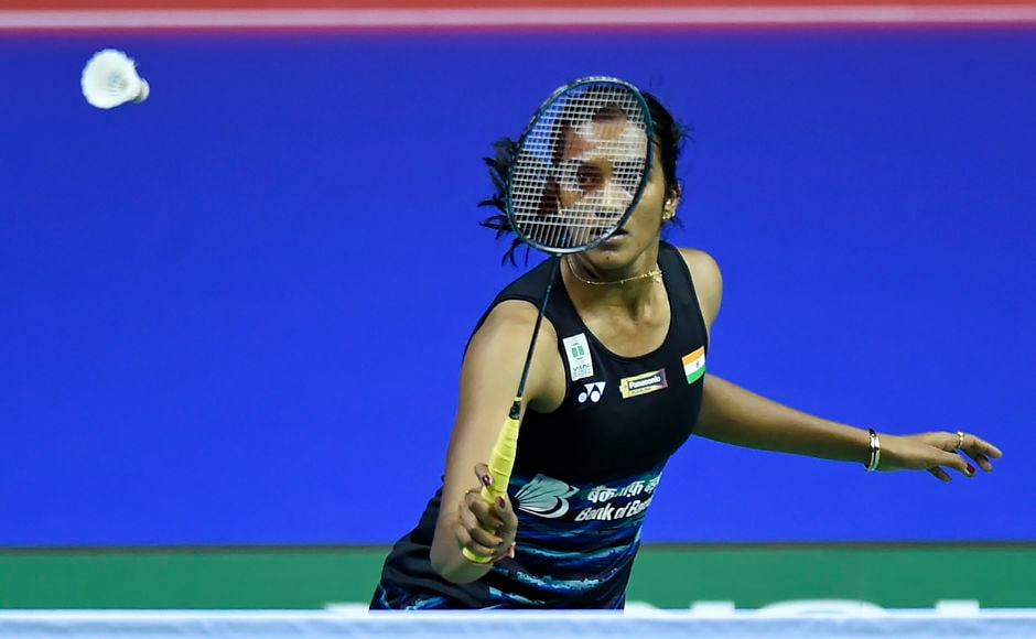 India's Sindhu Pusarla returns against Hong Kong's Cheung Ngan Yi during their round three women's singles match during the 2017 BWF World Championships of badminton at Emirates Arena in Glasgow on August 24, 2017. / AFP PHOTO / ANDY BUCHANAN