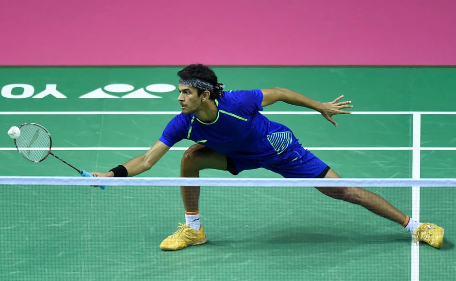India's Ajay Jayaram returns against China's Chen Long during their round three men's singles match during the 2017 BWF World Championships of badminton at Emirates Arena in Glasgow on August 24, 2017. / AFP PHOTO / ANDY BUCHANAN