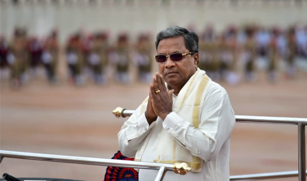 Karnataka chief minister Siddaramaiah greeted people during the celebration of Independence Day at Parade Ground in Bengaluru. In his address, he said that imposition of any language on a state, which has its own official language, is unconstitutional. PTI Karnataka chief minister Siddaramaiah greeted people during the celebration of Independence Day at Parade Ground in Bengaluru. In his address, he said that imposition of any language on a state, which has its own official language, is unconstitutional. PTI