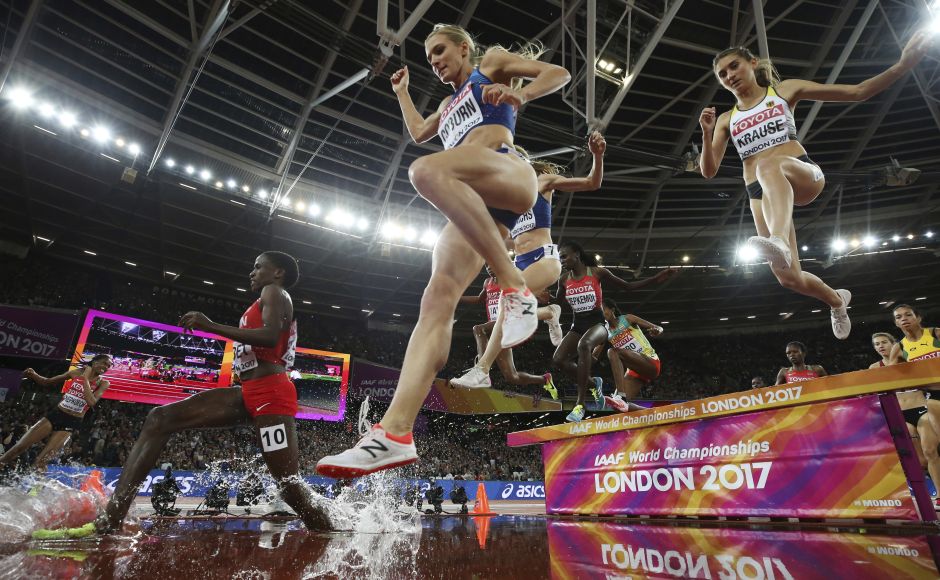 Emma Coburn took the lead for good at the final water jump and kicked for home to finish in a championship record of 9 minutes, 2.58 seconds. Courtney Frerichs was 1.19 seconds behind, holding off Hyvin Jepkemoi in a sprint finish. AP Emma Coburn took the lead for good at the final water jump and kicked for home to finish in a championship record of 9 minutes, 2.58 seconds. Courtney Frerichs was 1.19 seconds behind, holding off Hyvin Jepkemoi in a sprint finish. AP