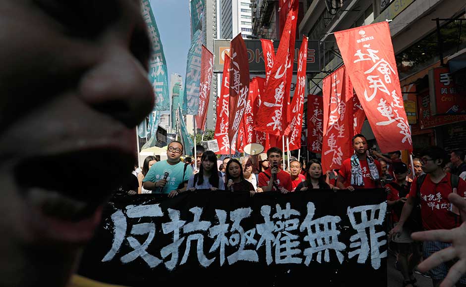 People took on the summer heat to stream from the eastern district of Wan Chai to the Court of Final Appeals in the heart of Hong Kong island, protesting the jail terms. They held signs including, People took on the summer heat to stream from the eastern district of Wan Chai to the Court of Final Appeals in the heart of Hong Kong island, protesting the jail terms. They held signs including,
