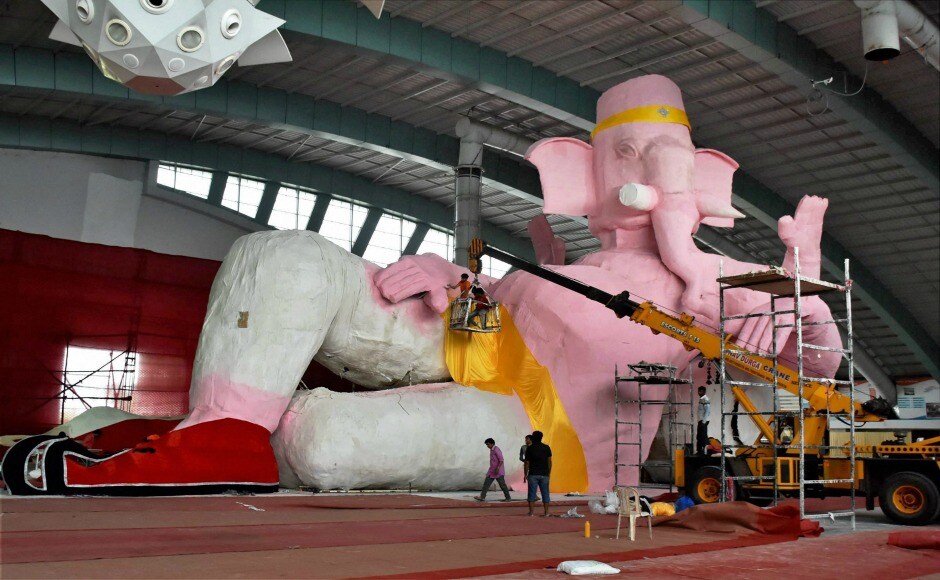 In Surat, devotees give final touches to a 153 feet idol of Lord Ganesha, claimed to be the biggest in India, in a pandal. PTI In Surat, devotees give final touches to a 153 feet idol of Lord Ganesha, claimed to be the biggest in India, in a pandal. PTI