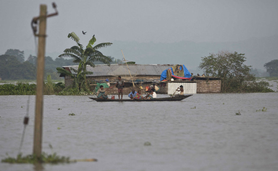 In Assam, the second wave of deluge has affected 25 of its 32 districts claiming 28 lives, besides displacing 33 lakh people. Waters of the Brahmaputra river is flowing above the danger mark at several places across the state. AP In Assam, the second wave of deluge has affected 25 of its 32 districts claiming 28 lives, besides displacing 33 lakh people. Waters of the Brahmaputra river is flowing above the danger mark at several places across the state. AP