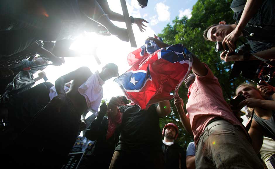 A video captured the car reversing, hitting more people, its windshield splintered from the collision and bumper dragging on the pavement. Medics carried the injured away as a police tank rolled down the street. The driver, James Alex Fields Jr, was charged with second-degree murder and other counts. In addition to Fields, at least three more men were arrested in connection with the protests. AP A video captured the car reversing, hitting more people, its windshield splintered from the collision and bumper dragging on the pavement. Medics carried the injured away as a police tank rolled down the street. The driver, James Alex Fields Jr, was charged with second-degree murder and other counts. In addition to Fields, at least three more men were arrested in connection with the protests. AP