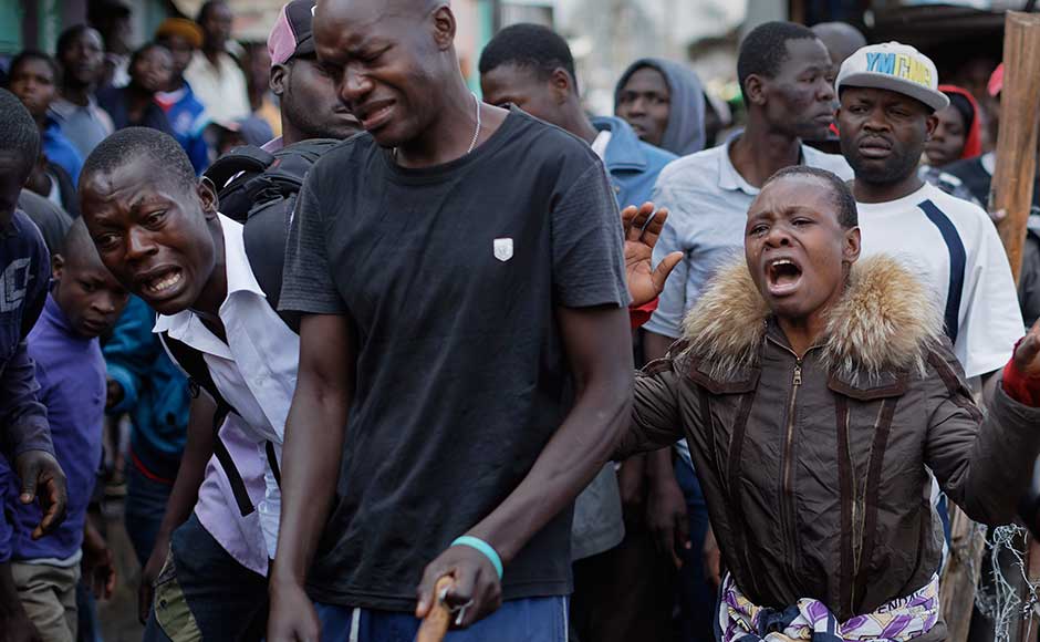 Clashes with protesters left two people dead in Nairobi's Mathare slum. The capital's police chief said officers opened fire after they were attacked by men wielding machetes. In the southeastern Tana river region, police killed two people after a group of five stormed a vote-tallying centre and stabbed one person. AP Clashes with protesters left two people dead in Nairobi's Mathare slum. The capital's police chief said officers opened fire after they were attacked by men wielding machetes. In the southeastern Tana river region, police killed two people after a group of five stormed a vote-tallying centre and stabbed one person. AP