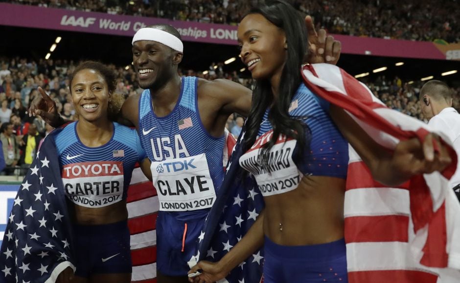 American triple jump silver medal winner Will Claye (centre) celebrates with women's 400m hurdles gold medal winner Kori Carter (L) and silver medal winner Dalilah Muhammad (R). AP American triple jump silver medal winner Will Claye (centre) celebrates with women's 400m hurdles gold medal winner Kori Carter (L) and silver medal winner Dalilah Muhammad (R). AP
