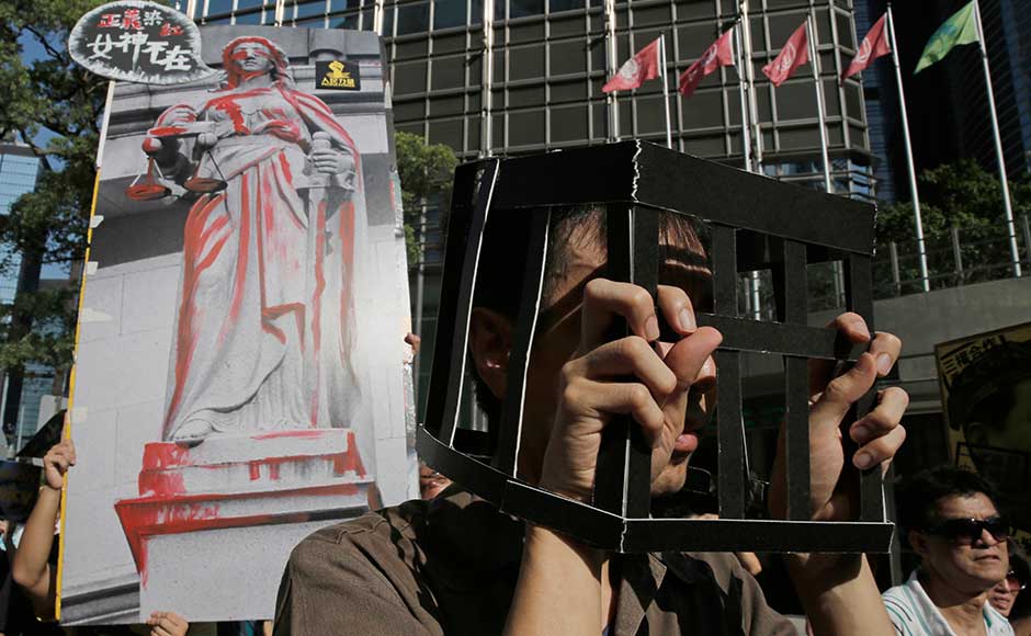 Wong and former legislator Law, who was disqualified from Parliament last month following Beijing's intervention, had expressed their intention to run for office in future elections but will be prevented from standing for five years because their jail terms exceeded three months. Wong, 20, is currently held in a high-security prison for young male offenders. Law and Chow are at a maximum security holding centre. AP Wong and former legislator Law, who was disqualified from Parliament last month following Beijing's intervention, had expressed their intention to run for office in future elections but will be prevented from standing for five years because their jail terms exceeded three months. Wong, 20, is currently held in a high-security prison for young male offenders. Law and Chow are at a maximum security holding centre. AP