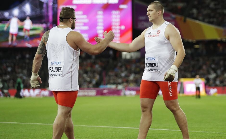 Poland's gold medal winner Pawel Fajdek (L) and bronze medal winner and compatriot Wojciech Nowicki congratulate each other after the men's hammer throw final. Russia's Valeriy Pronkin took silver ahead of Nowicki. AP Poland's gold medal winner Pawel Fajdek (L) and bronze medal winner and compatriot Wojciech Nowicki congratulate each other after the men's hammer throw final. Russia's Valeriy Pronkin took silver ahead of Nowicki. AP
