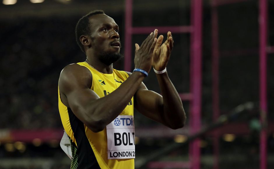 Usain Bolt stuck to tradition in his farewell championships, revving up the crowd at the Olympic Stadium with his aura before his victory in the first-round heat of the 100 meters. AP Usain Bolt stuck to tradition in his farewell championships, revving up the crowd at the Olympic Stadium with his aura before his victory in the first-round heat of the 100 meters. AP
