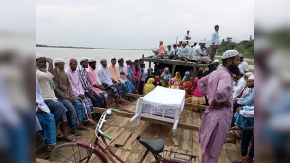 Marooned by floods, Assam's dead get watery grave as land disappear