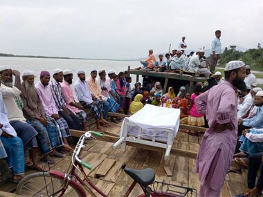 Marooned by floods, Assam's dead get watery grave as land disappear