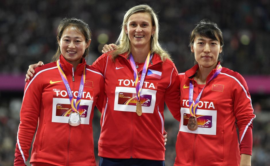 Women's javelin gold medalist Barbora Spotakova (Centre) stands with silver medalist China's Li Lingwei (L) and bronze medalist China's Lyu Huihui on the podium following the medal ceremony. Women's javelin gold medalist Barbora Spotakova (Centre) stands with silver medalist China's Li Lingwei (L) and bronze medalist China's Lyu Huihui on the podium following the medal ceremony.